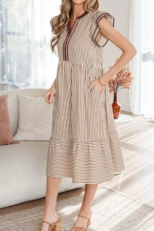 Striped midi dress with tiered hem, ruffle sleeves, and pockets.