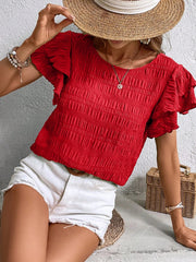 Red smocked blouse with ruffle sleeves and textured fabric