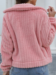 Textured teddy bear jacket in light mauve with ribbed details and a collar.