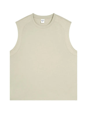 Sleeveless beige tank top with shoulder seam detail and crew neck.