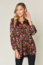 Silk ikat tie-neck blouse with button closure and abstract print