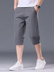 Men's grey chino shorts with pockets and belt loops.