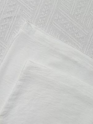 White maternity wide-leg pants with drawstring detail, relaxed fit