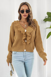 Camel knit cardigan with ruffled collar and button front, styled with jeans.