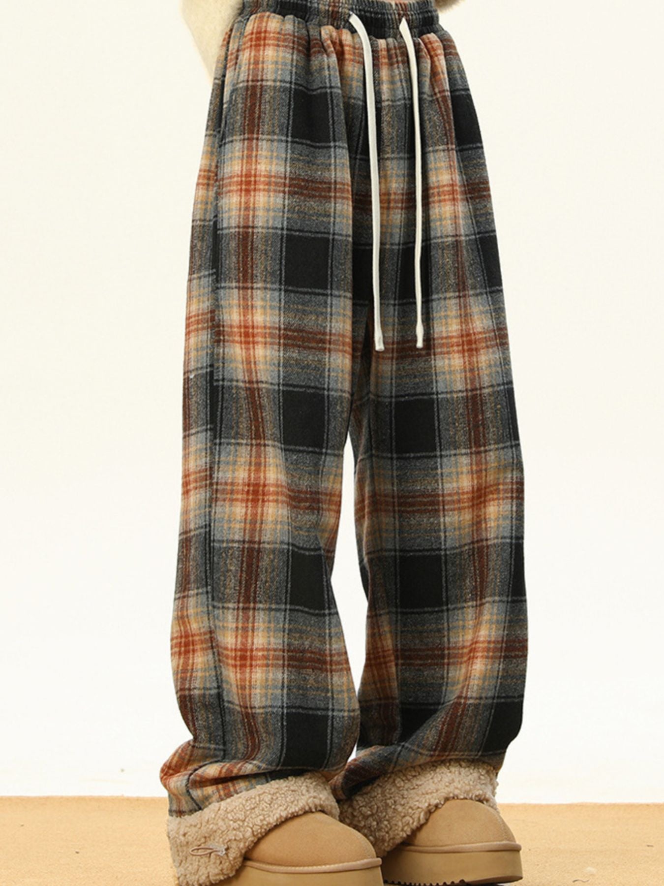 Men's plus-size plaid sweatpants with drawstring and elastic waist.