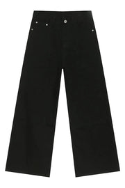 Black balloon leg jeans with a wide, straight cut and silver button details.