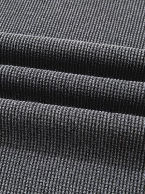 Dark gray waffle knit oversized sweatshirt with textured cotton blend fabric detail.
