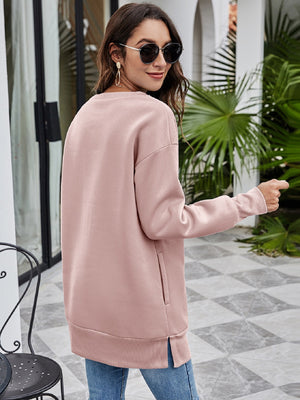 Dusty Pink tunic sweatshirt with side pockets and ribbed cuffs.