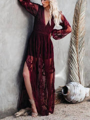 Burgundy floral lace maxi dress with plunging neckline, long bell sleeves, and high slit.