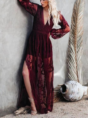 Burgundy floral lace maxi dress with plunging neckline, long bell sleeves, and high slit.