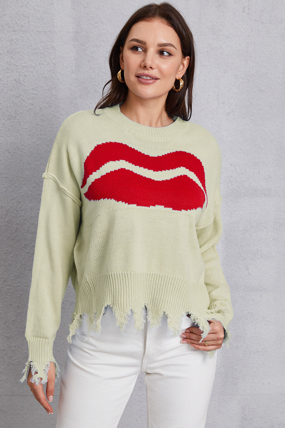 Light Yellow knit sweater with red kiss graphic and distressed hem.