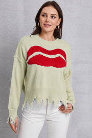 Light Yellow knit sweater with red kiss graphic and distressed hem.