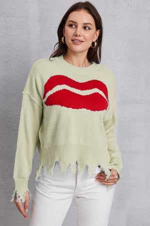 Light Yellow knit sweater with red kiss graphic and distressed hem.