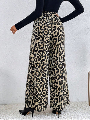 Leopard print palazzo trousers with a high waist and wide leg, styled with a black top and heels.
