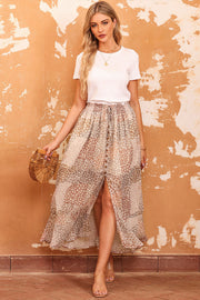 Patchwork floral maxi skirt with adjustable button waist.