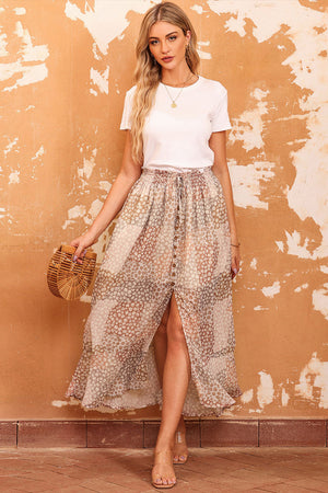Patchwork floral maxi skirt with adjustable button waist.