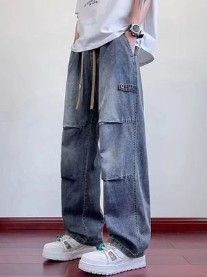Oversized wide-leg jeans in blue denim with cargo pockets and a drawstring waist.