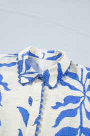 Botanical print button-down maxi dress with scalloped collar and cuffs in blue and white.
