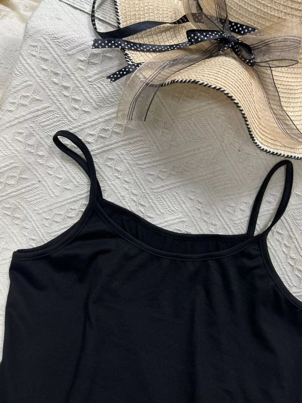 Black cami top with scoop neck and thin straps