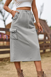 Mid gray utility pocket midi skirt with drawstring waist and button flap pockets.