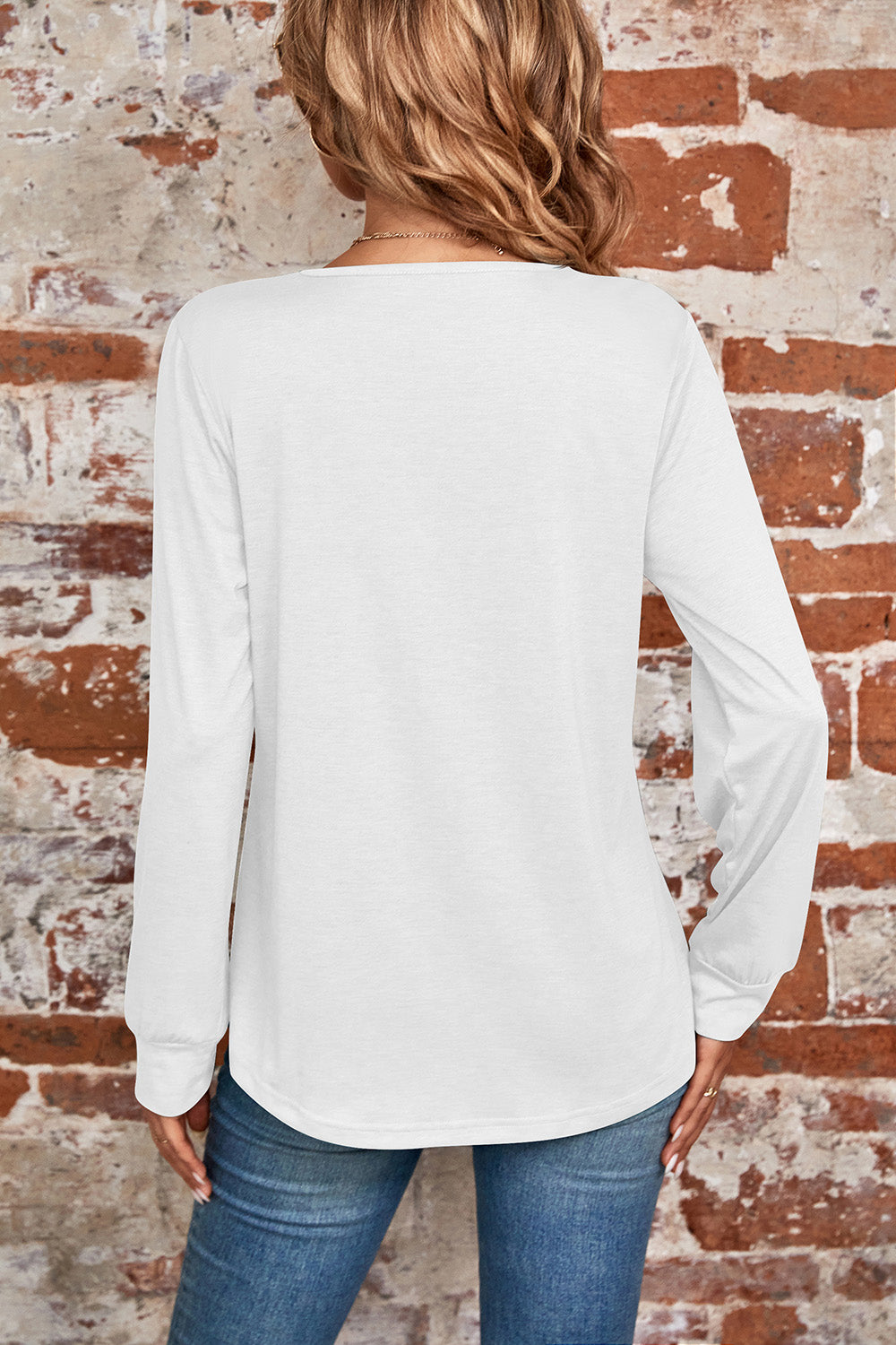 White long sleeve top with square neckline and subtle pleats, casual chic style