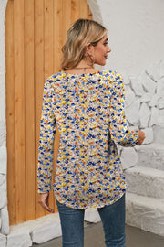 Floral print long sleeve blouse with gathered square neckline.