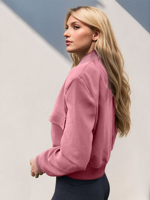 Boxy bomber jacket in dusty pink with a relaxed fit and pocket detail.