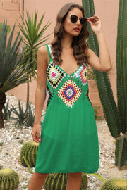 Green crochet yoke cover-up dress with colorful granny squares and V-neck