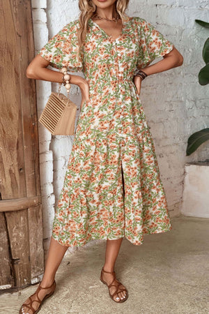 Floral midi dress with flutter sleeves, V-neck, button front, and tiered skirt with a slit