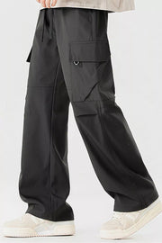 Black cargo pants with multiple pockets and a drawstring waist.