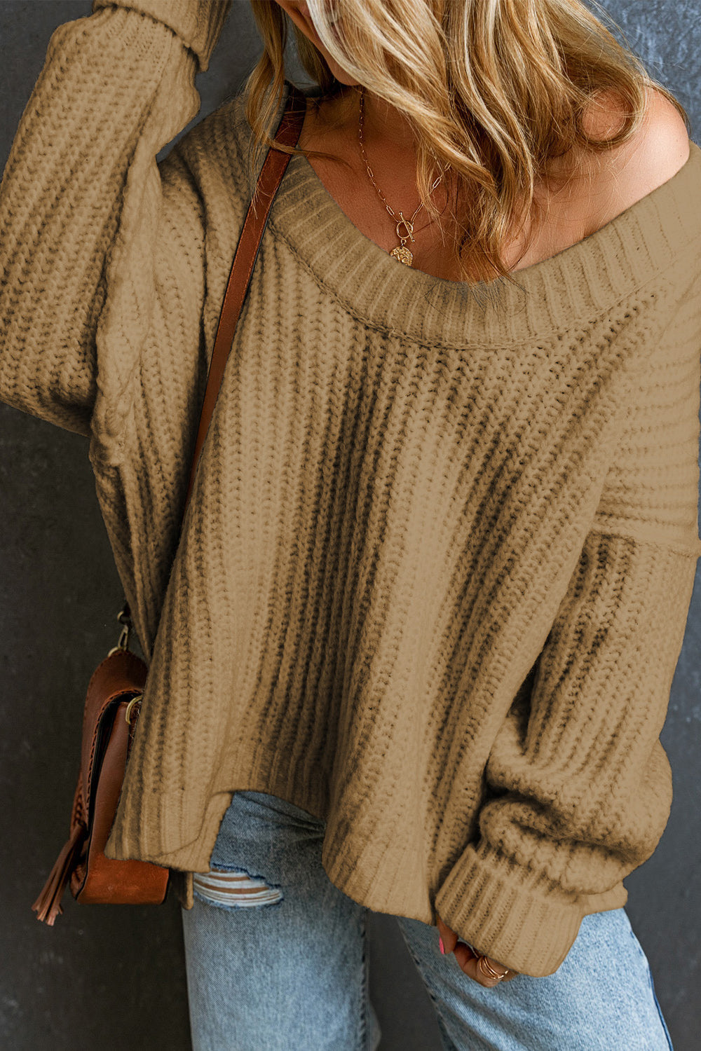 Camel chunky ribbed knit sweater with wide neckline and long sleeves.