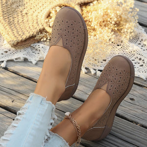 Coffee floral cutout slip-on loafers with breathable design.