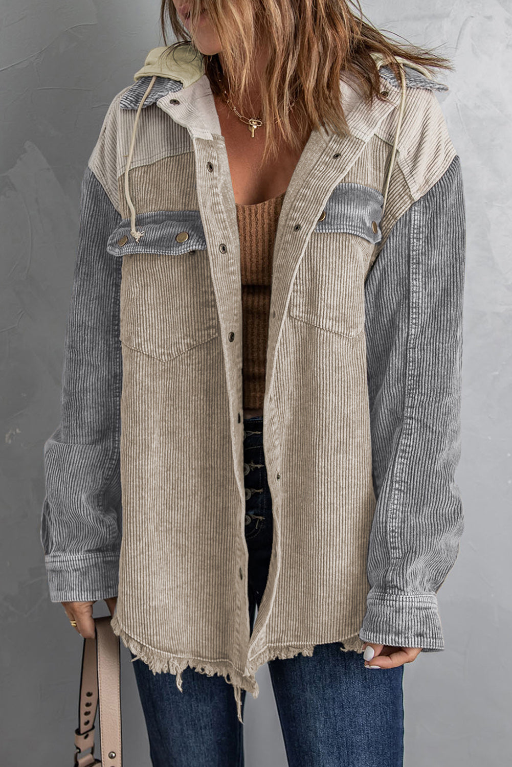 Colorblock corduroy hooded utility jacket with frayed hem and chest pockets.
