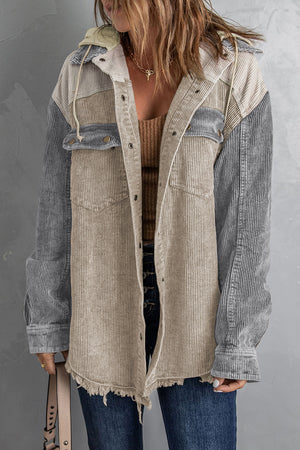 Colorblock corduroy hooded utility jacket with frayed hem and chest pockets.