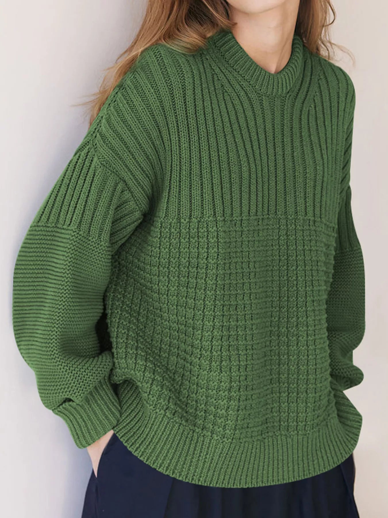 Moss green textured knit pullover sweater with round neck and ribbed details