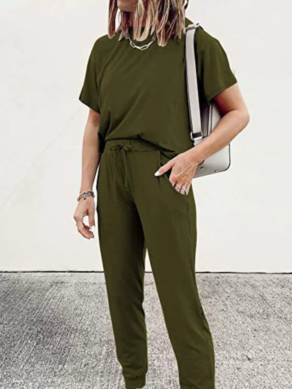 Army green casual round neck top and jogger pants set with drawstring waist.