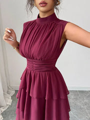 Dark Red sleeveless ruffle tiered dress with ruched bodice and mock neck.