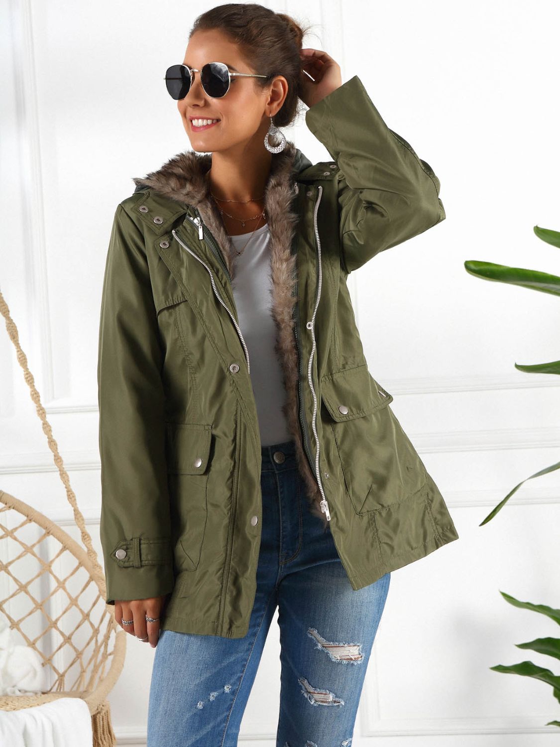 Belted utility parka in army green with faux fur trim and hood, featuring multiple pockets.