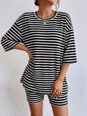 Chic striped two-piece set with elbow sleeve top and shorts in black stripes.