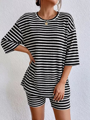 Chic striped two-piece set with elbow sleeve top and shorts in black stripes.