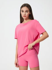 Relaxed fit performance tee in Fuchsia Pink with crew neck and short sleeves.