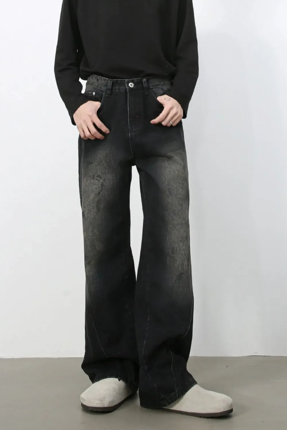 Faded wash wide leg denim jeans in dark with a distressed look.