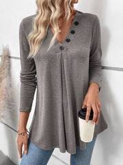 Gray button-placket tunic with V-neck and subtle front pleats.