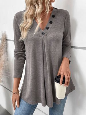 Gray button-placket tunic with V-neck and subtle front pleats.
