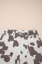 Cow print utility jeans in cotton blend with cargo pockets.