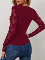 Burgundy ribbed long sleeve top with lace sleeves and scalloped detail.