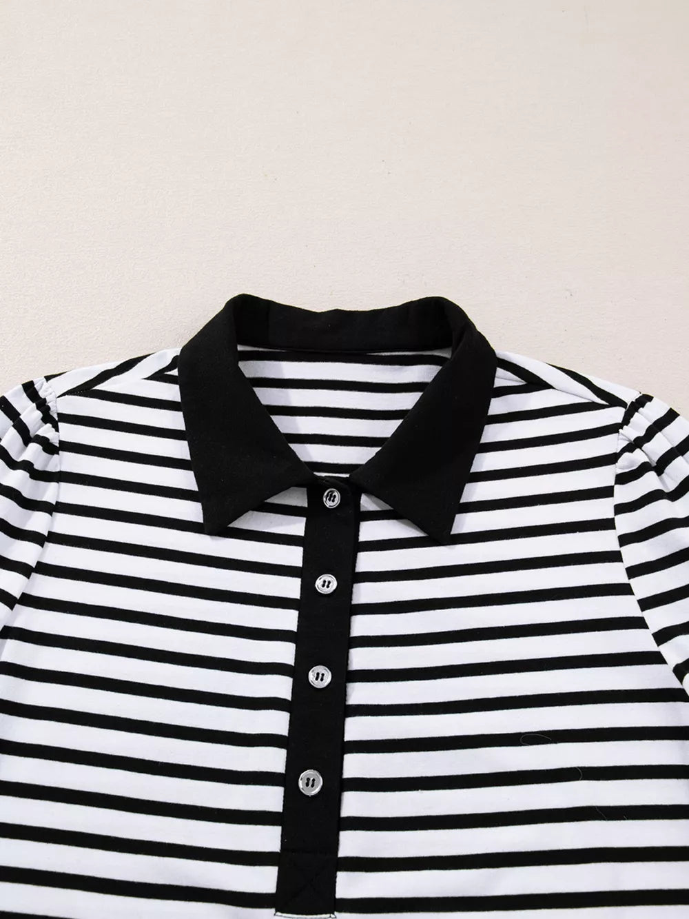 Black and white striped collared long sleeve dress with button front detail.