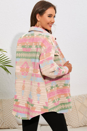 Aztec print shacket in dusty pink with patch pockets and button closure.