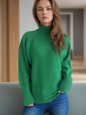 Dark green ribbed turtleneck sweater with subtle sparkle details and cuffed sleeves.