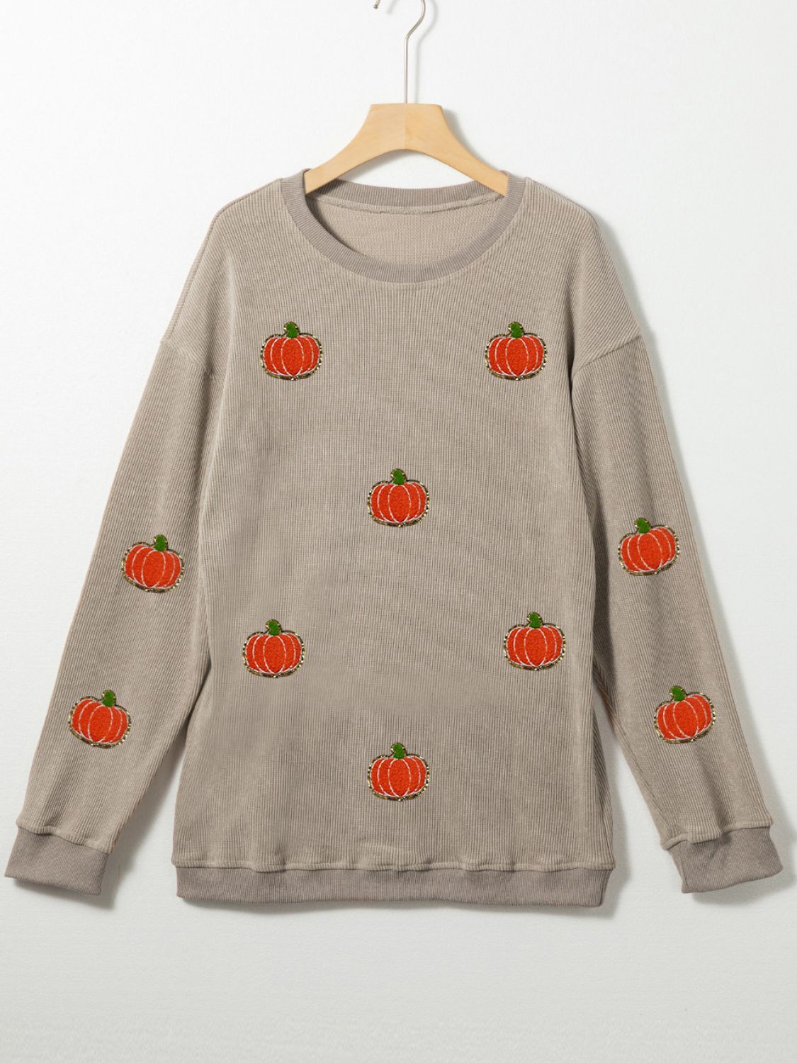 Embroidered corduroy sweatshirt in Dust Storm with allover pumpkin pattern.